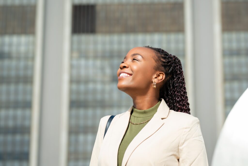 A professional woman looking confident and optimistic.
